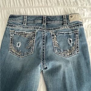 Silver Suki denim boot cut mid rise jeans. Size 32x34